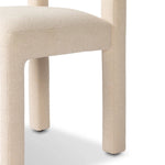 Fit for modern dining, this clean-styled chair is fully upholstered in a specialized performance fabric. An open back connects down to the cylindrical legs. Slight scale and squared off shape are great for smaller dining areas. Amethyst Home provides interior design, new home construction design consulting, vintage area rugs, and lighting in the Charlotte metro area.