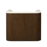 Designed with a shelter-style silhouette, this swivel chair wraps around for a seamless sit. The showstopping wood fluting adds textural contrast and organic appeal to the 360-degree swivel.As fans of clean aesthetics at Amethyst, we love the nature inspired Rory Swivel Chair - Laughlin Bone. Amethyst Home provides interior design, new home construction design consulting, vintage area rugs, and lighting in the Boston metro area.