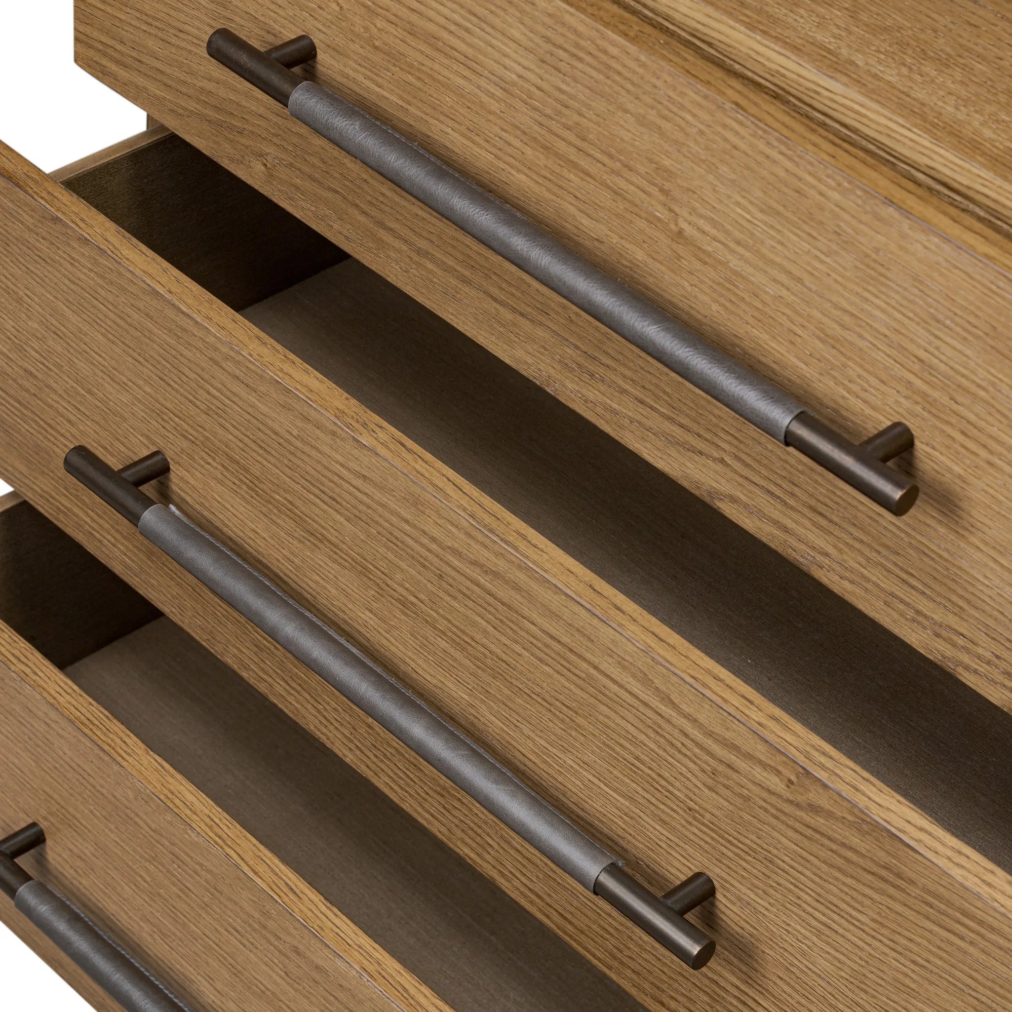 Amber-finished oak forms a clean silhouette for three spacious drawers with iron hardware wrapped in black top-grain leather. This item has been modified to comply with the STURDY Act. See a full list of modified products and data changes in the “STURDY Act” file in the Downloads section below Amethyst Home provides interior design, new home construction design consulting, vintage area rugs, and lighting in the Salt Lake City metro area.