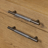 Amber-finished oak crafts shapes a clean silhouette, accented with iron hardware wrapped in black top-grain leather. Vary-sized drawers offer plenty of storage, while outset legs bring a design-forward touch Amethyst Home provides interior design, new home construction design consulting, vintage area rugs, and lighting in the Kansas City metro area.