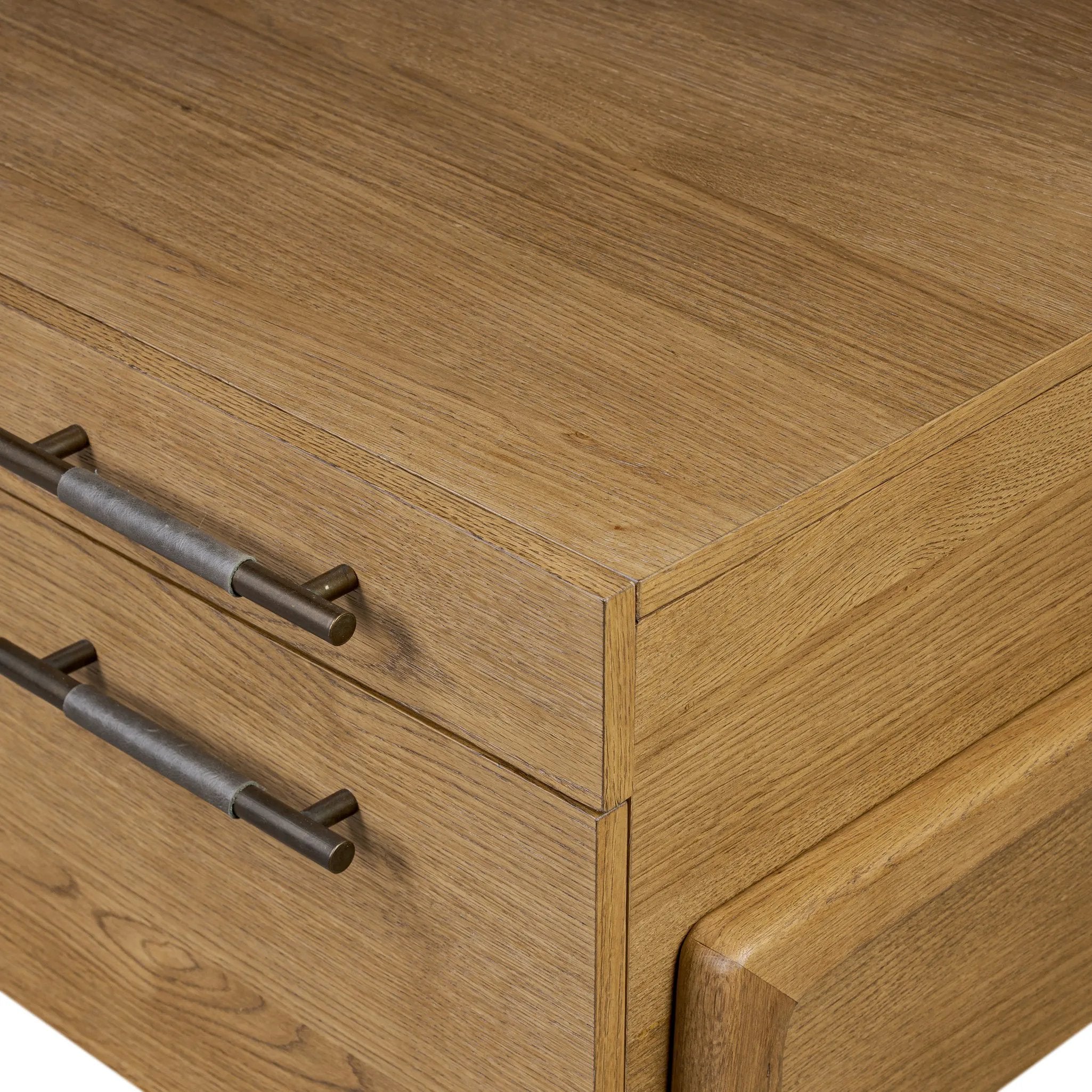 Amber-finished oak crafts shapes a clean silhouette, accented with iron hardware wrapped in black top-grain leather. Vary-sized drawers offer plenty of storage, while outset legs bring a design-forward touch Amethyst Home provides interior design, new home construction design consulting, vintage area rugs, and lighting in the Portland metro area.