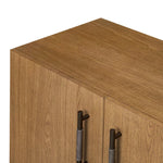 Amber-finished oak forms a clean silhouette with plenty of storage, accented with long iron hardware wrapped in black top-grain leather. Outset legs add an element of interest. Rear cutouts for cord management Amethyst Home provides interior design, new home construction design consulting, vintage area rugs, and lighting in the Park City metro area.