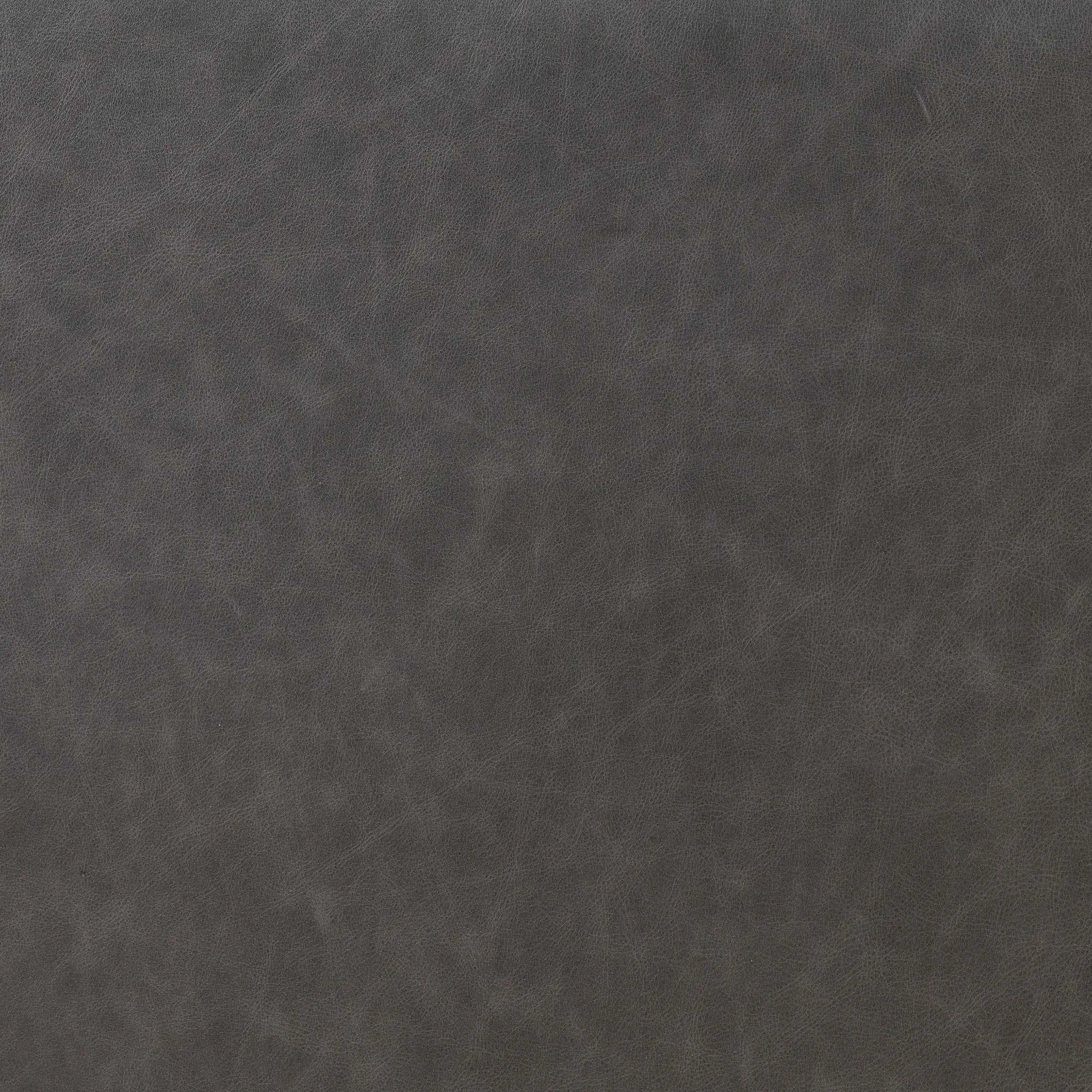 Amber-finished solid oak frames a floating, sling-style headboard made from black top-grain leather, with subtly rounded edges and metal dowel detailing Amethyst Home provides interior design, new home construction design consulting, vintage area rugs, and lighting in the Miami metro area.