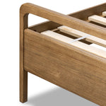 Amber-finished solid oak frames a floating, sling-style headboard made from black top-grain leather, with subtly rounded edges and metal dowel detailing Amethyst Home provides interior design, new home construction design consulting, vintage area rugs, and lighting in the Scottsdale metro area.