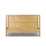 Amber-finished solid oak frames a floating, sling-style headboard made from black top-grain leather, with subtly rounded edges and metal dowel detailing Amethyst Home provides interior design, new home construction design consulting, vintage area rugs, and lighting in the Tampa metro area.