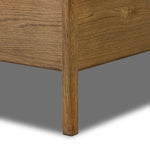 Amber-finished solid oak frames a floating, sling-style headboard made from black top-grain leather, with subtly rounded edges and metal dowel detailing Amethyst Home provides interior design, new home construction design consulting, vintage area rugs, and lighting in the Winter Garden metro area.