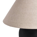 In this black terra cotta vase table lamp, each piece bears unique touches from its natural finishing process. Topped with a shade of natural linen, for a textural contrast.Collection: Rockwel Amethyst Home provides interior design, new home construction design consulting, vintage area rugs, and lighting in the Kansas City metro area.