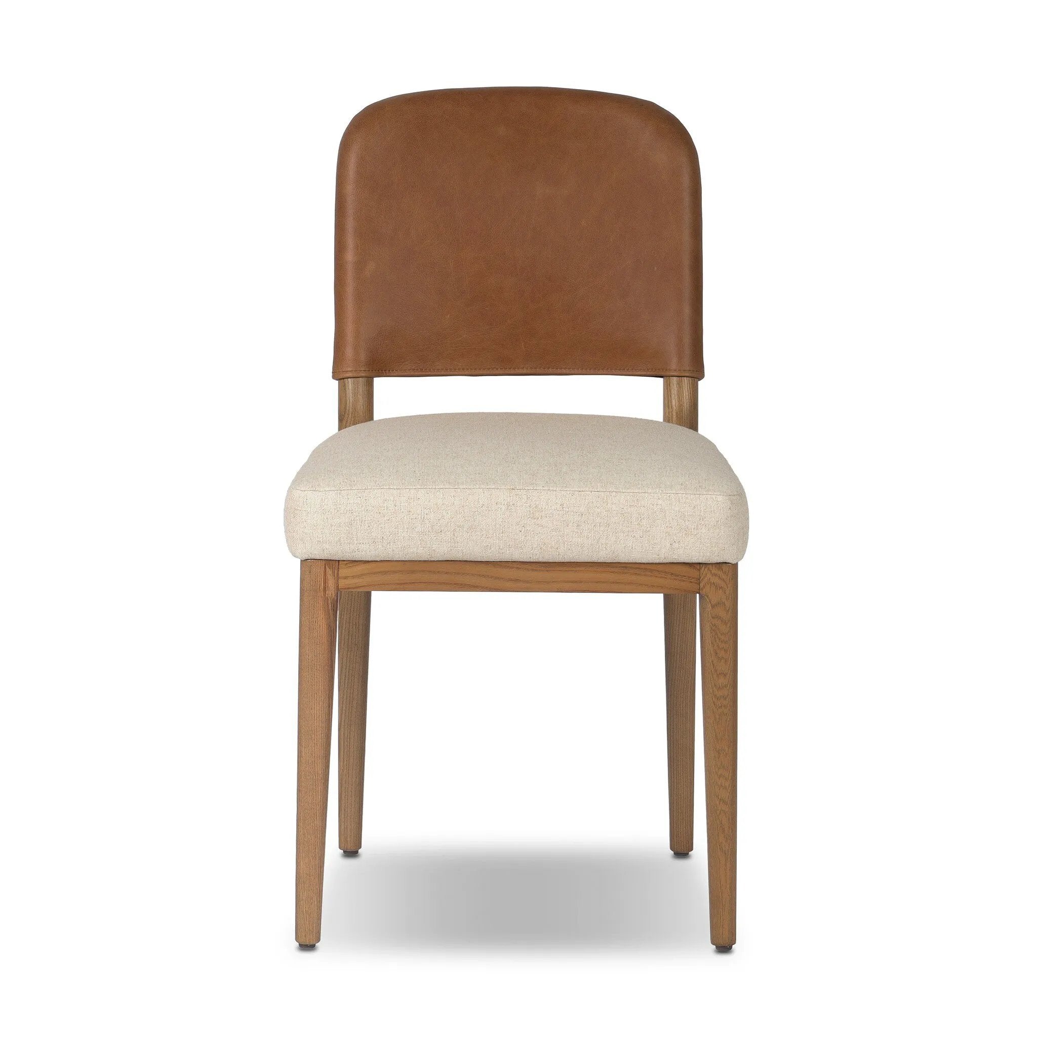 The classic material mix look you want in your dining space. Butterscotch top-grain leather with a subtle vintage look pairs with a neutral performance fabric-upholstered seat. Tapered legs and an armless silhouette look timelessly chic. Amethyst Home provides interior design, new home construction design consulting, vintage area rugs, and lighting in the Calabasas metro area.