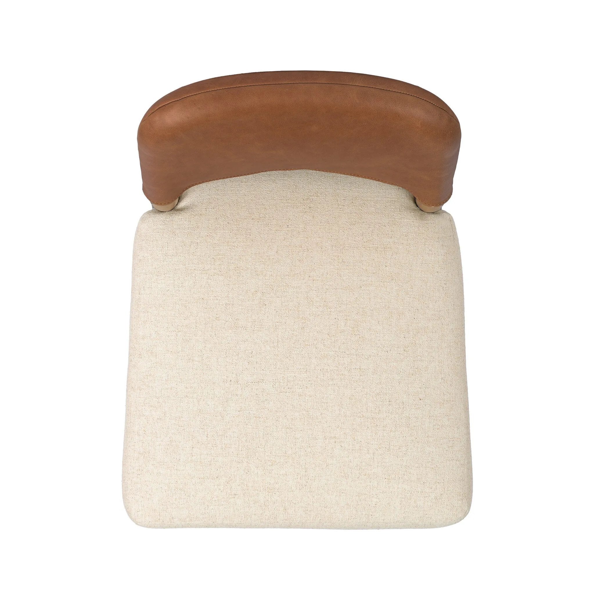 The classic material mix look you want in your dining space. Butterscotch top-grain leather with a subtle vintage look pairs with a neutral performance fabric-upholstered seat. Tapered legs and an armless silhouette look timelessly chic. Amethyst Home provides interior design, new home construction design consulting, vintage area rugs, and lighting in the Newport Beach metro area.