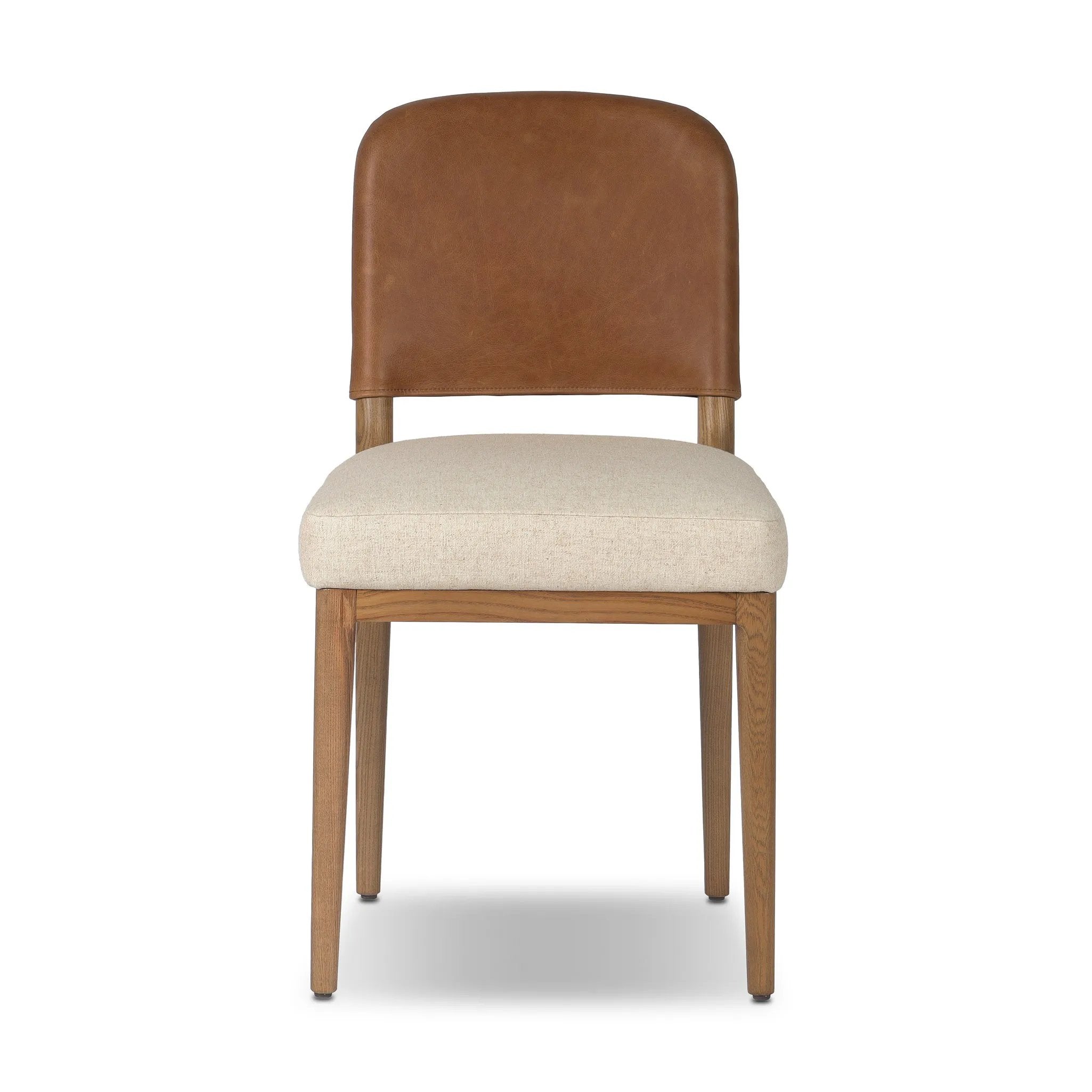 The classic material mix look you want in your dining space. Butterscotch top-grain leather with a subtle vintage look pairs with a neutral performance fabric-upholstered seat. Tapered legs and an armless silhouette look timelessly chic. Amethyst Home provides interior design, new home construction design consulting, vintage area rugs, and lighting in the Salt Lake City metro area.