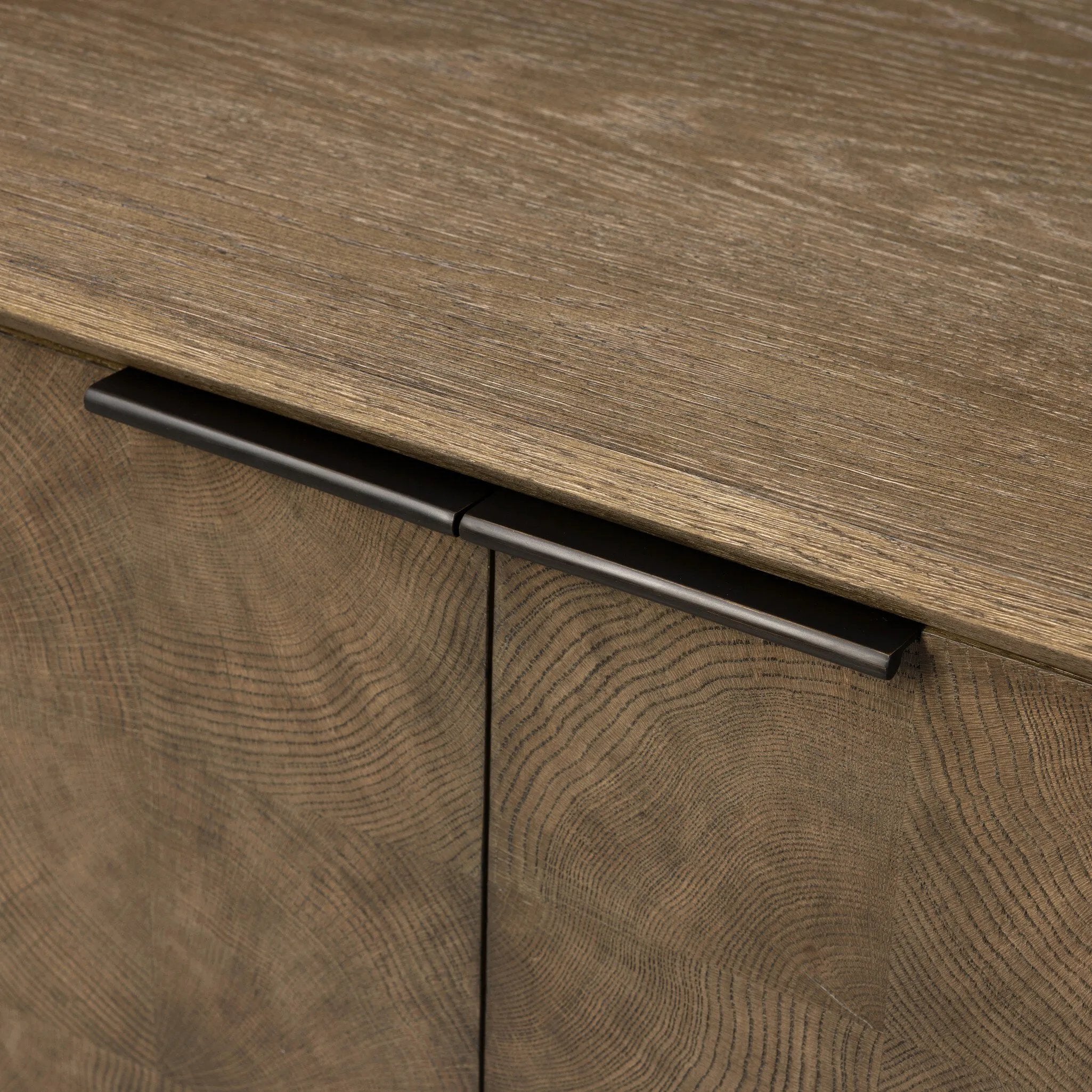 This media console’s simple frame showcases thick brown oak veneer with an oyster cut grid pattern on the door and drawer fronts. Minimalist metal pulls open to ample storage for living space essentials. Rear cutouts for cord management.As lovers of luxe style at Amethyst, we love the designer inspired Salta Media Console - Brown Oak Thick Veneer. Amethyst Home provides interior design, new home construction design consulting, vintage area rugs, and lighting in the Laguna Beach metro area.