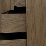 Influenced by contemporary design, this nightstand’s simple frame showcases thick brown oak veneer with a tiled oyster cut pattern on the insert panels. Three drawers with minimalist metal pulls offer ample space for bedside essentials. Amethyst Home provides interior design, new home construction design consulting, vintage area rugs, and lighting in the Los Angeles metro area.