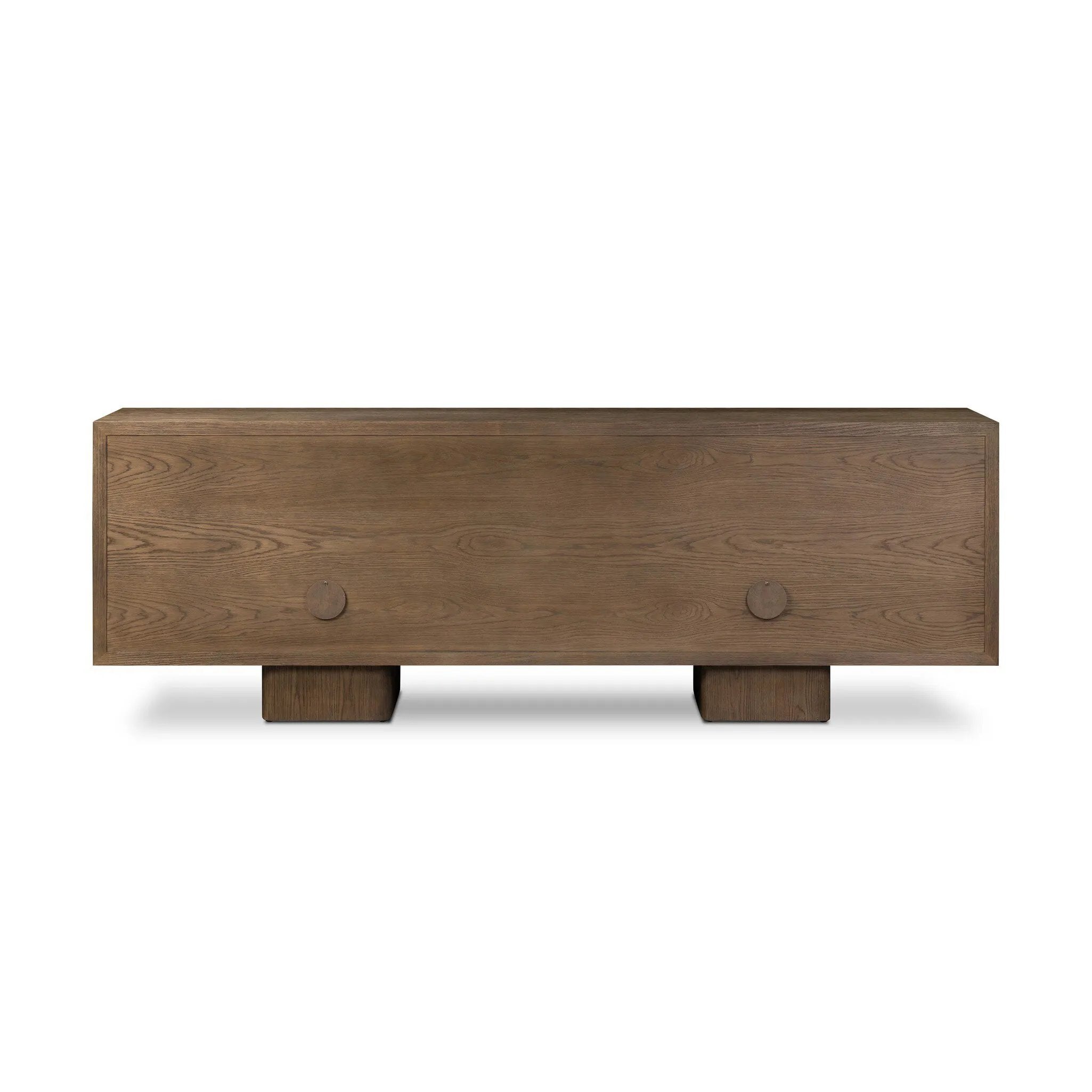 Grounding and stunning. We paired a modern frame and chunky base with door panels featuring oyster cuts of oak that take a specialized skill to create. Each cut captures the story of the wood and brings a natural, organic rhythm to the entire sideboard, and any space. Amethyst Home provides interior design, new home construction design consulting, vintage area rugs, and lighting in the Calabasas metro area.