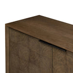 Grounding and stunning. We paired a modern frame and chunky base with door panels featuring oyster cuts of oak that take a specialized skill to create. Each cut captures the story of the wood and brings a natural, organic rhythm to the entire sideboard, and any space. Amethyst Home provides interior design, new home construction design consulting, vintage area rugs, and lighting in the Des Moines metro area.