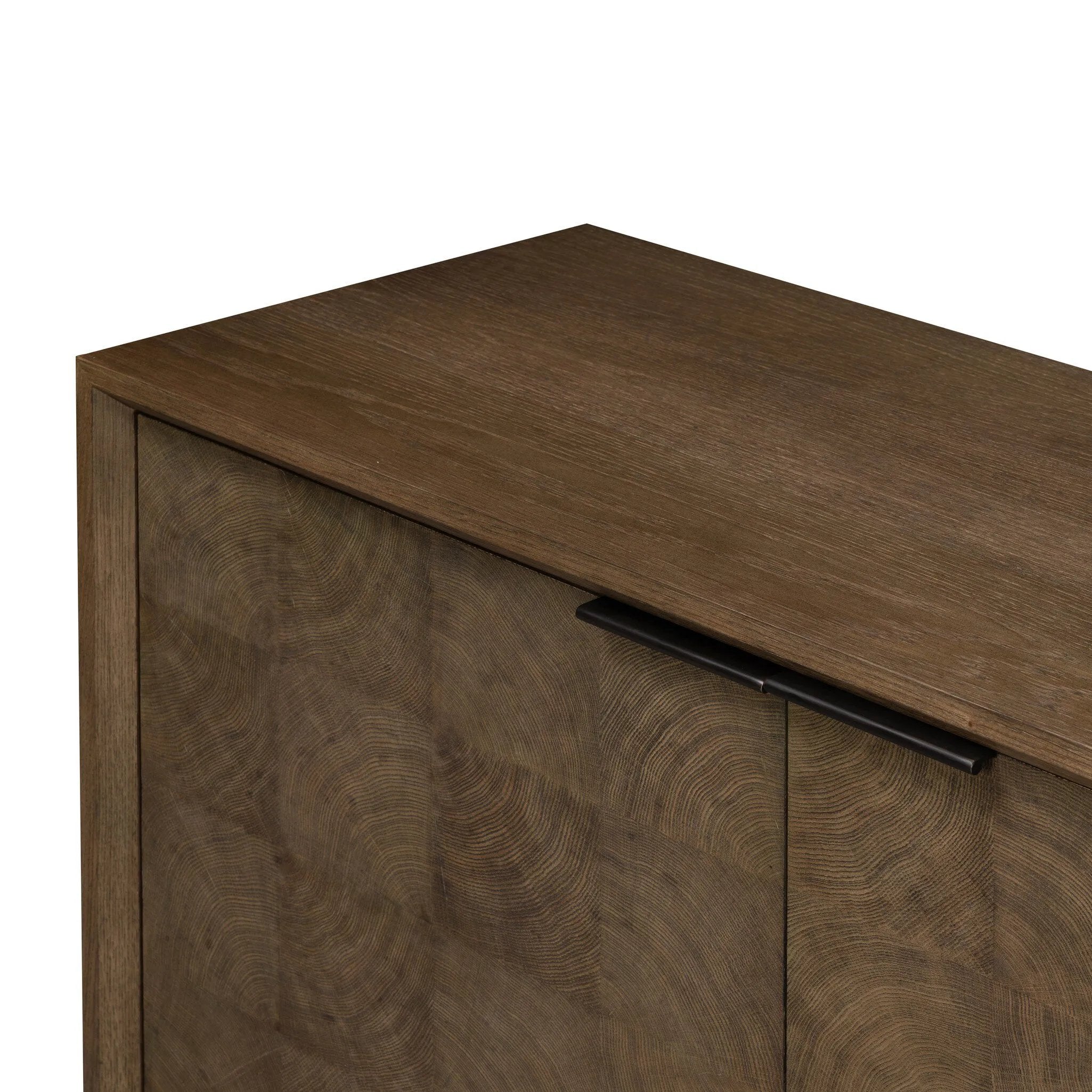 Grounding and stunning. We paired a modern frame and chunky base with door panels featuring oyster cuts of oak that take a specialized skill to create. Each cut captures the story of the wood and brings a natural, organic rhythm to the entire sideboard, and any space. Amethyst Home provides interior design, new home construction design consulting, vintage area rugs, and lighting in the Des Moines metro area.