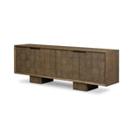 Grounding and stunning. We paired a modern frame and chunky base with door panels featuring oyster cuts of oak that take a specialized skill to create. Each cut captures the story of the wood and brings a natural, organic rhythm to the entire sideboard, and any space. Amethyst Home provides interior design, new home construction design consulting, vintage area rugs, and lighting in the Houston metro area.