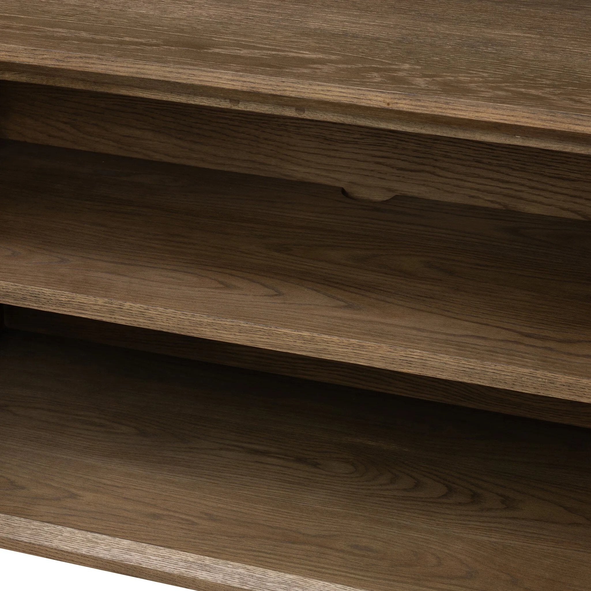 Grounding and stunning. We paired a modern frame and chunky base with door panels featuring oyster cuts of oak that take a specialized skill to create. Each cut captures the story of the wood and brings a natural, organic rhythm to the entire sideboard, and any space. Amethyst Home provides interior design, new home construction design consulting, vintage area rugs, and lighting in the Monterey metro area.