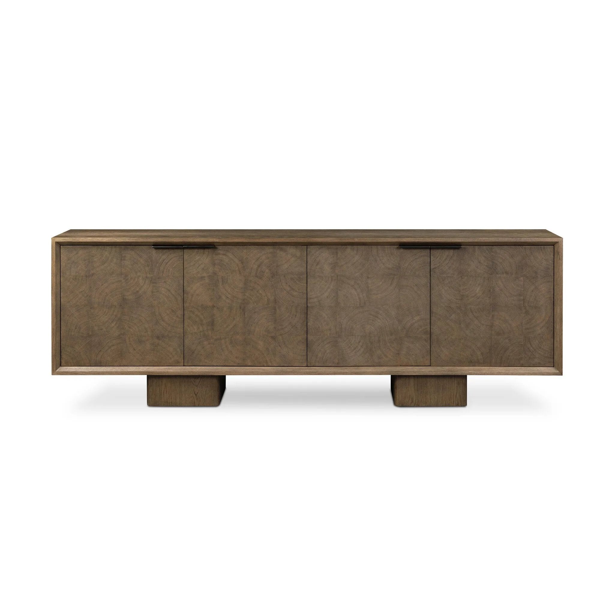 Grounding and stunning. We paired a modern frame and chunky base with door panels featuring oyster cuts of oak that take a specialized skill to create. Each cut captures the story of the wood and brings a natural, organic rhythm to the entire sideboard, and any space. Amethyst Home provides interior design, new home construction design consulting, vintage area rugs, and lighting in the Washington metro area.