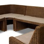 Antique-inspired coastal style. Rattan introduces varying natural shades and texture to this dining bench, and the frame's soft lines and beige and white striped fabric cushion invite a comfortable sit. Option to style alone or pair with other pieces in the collection. A design collaboration by Amber Lewis and Four Hands. Amethyst Home provides interior design, new home construction design consulting, vintage area rugs, and lighting in the Calabasas metro area.