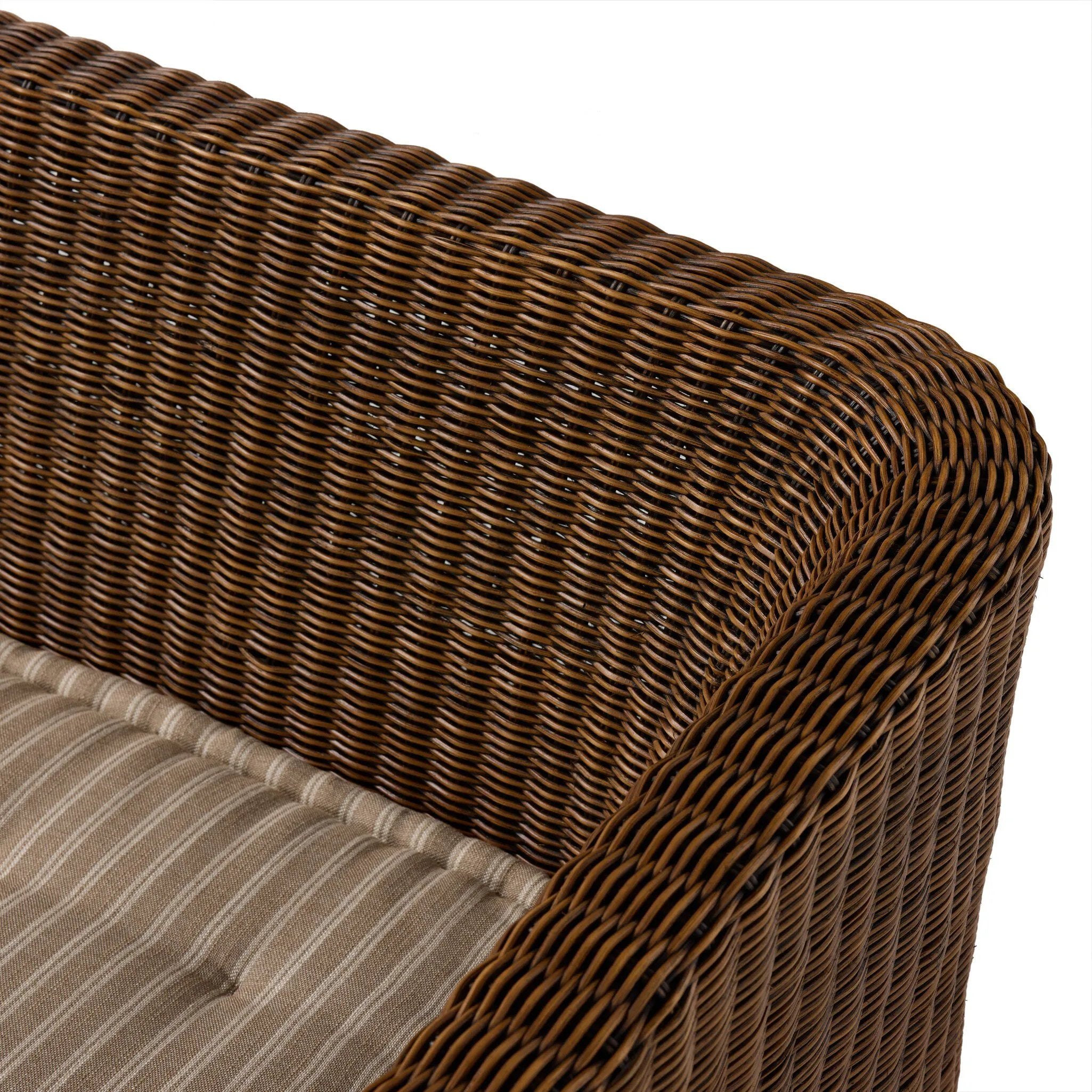 Antique-inspired coastal style. Rattan introduces varying natural shades and texture to this dining bench, and the frame's soft lines and beige and white striped fabric cushion invite a comfortable sit. Option to style alone or pair with other pieces in the collection. A design collaboration by Amber Lewis and Four Hands. Amethyst Home provides interior design, new home construction design consulting, vintage area rugs, and lighting in the Park City metro area.