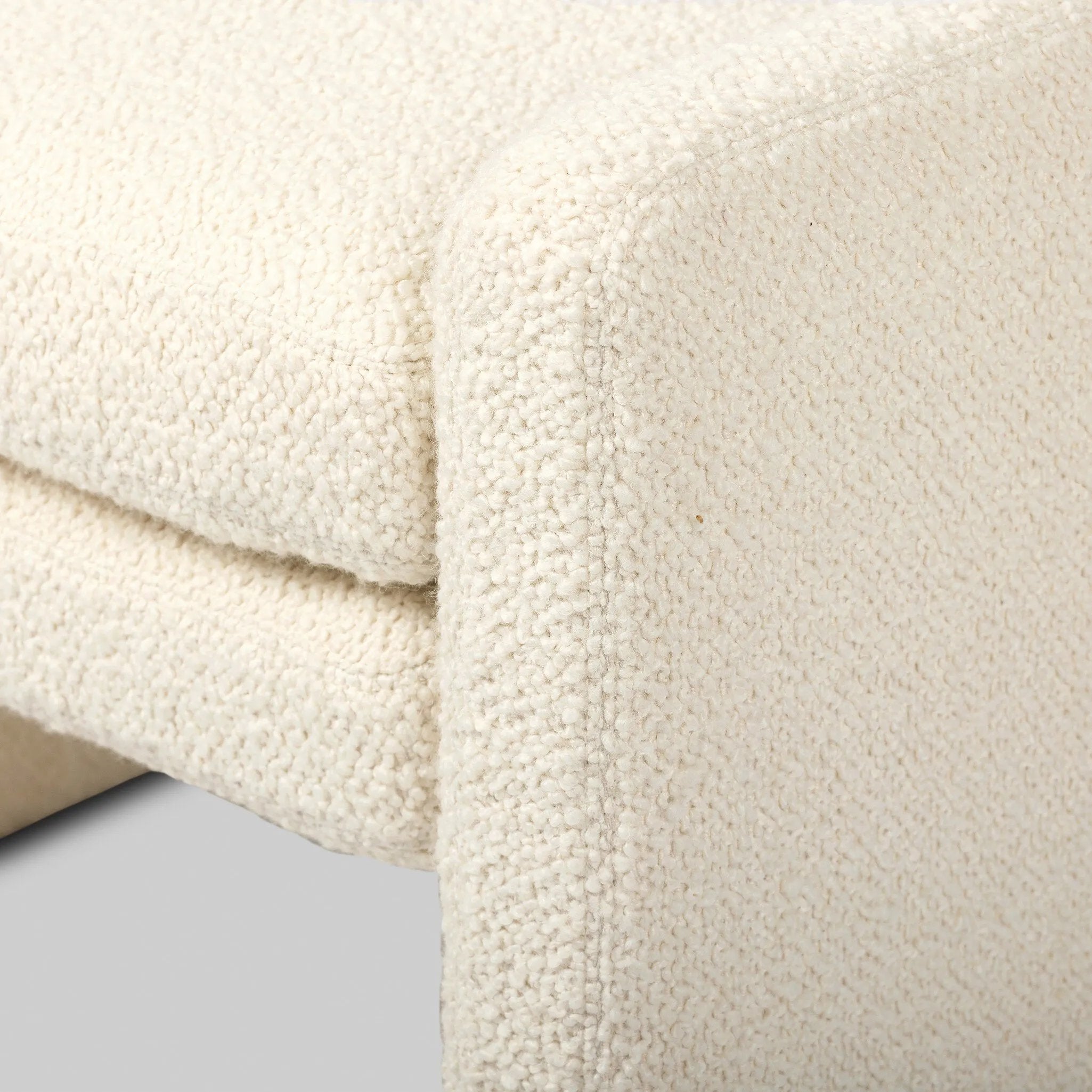 A traditional wool-blend fabric in cream covers this versatile ottoman for an easy fit in any room Amethyst Home provides interior design, new home construction design consulting, vintage area rugs, and lighting in the Park City metro area.