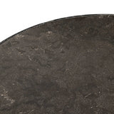 Mixed materials make for great drama. A cone-tapered base of dark oak supports a rounded tabletop of solid bluestone, with oak banding on the edges for thoughtful contrast Amethyst Home provides interior design, new home construction design consulting, vintage area rugs, and lighting in the Tampa metro area.