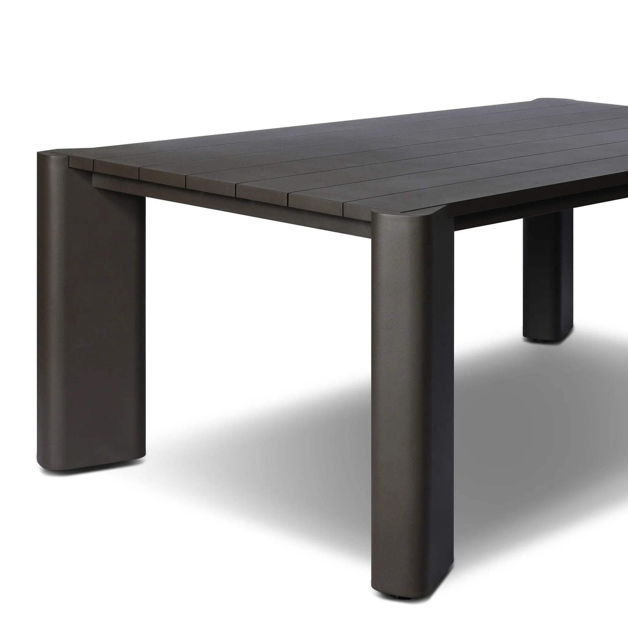 A Parsons-style outdoor dining table is defined by heavy proportions and angled, over-scaled legs. Crafted from bronze finished metal for a material statement. Cover or store indoors during inclement weather and when not in use.As lovers of wabi sabi materials at Amethyst, we love the nature inspired Soho Outdoor Metal Dining Table 86". Amethyst Home provides interior design, new home construction design consulting, vintage area rugs, and lighting in the Calabasas metro area.