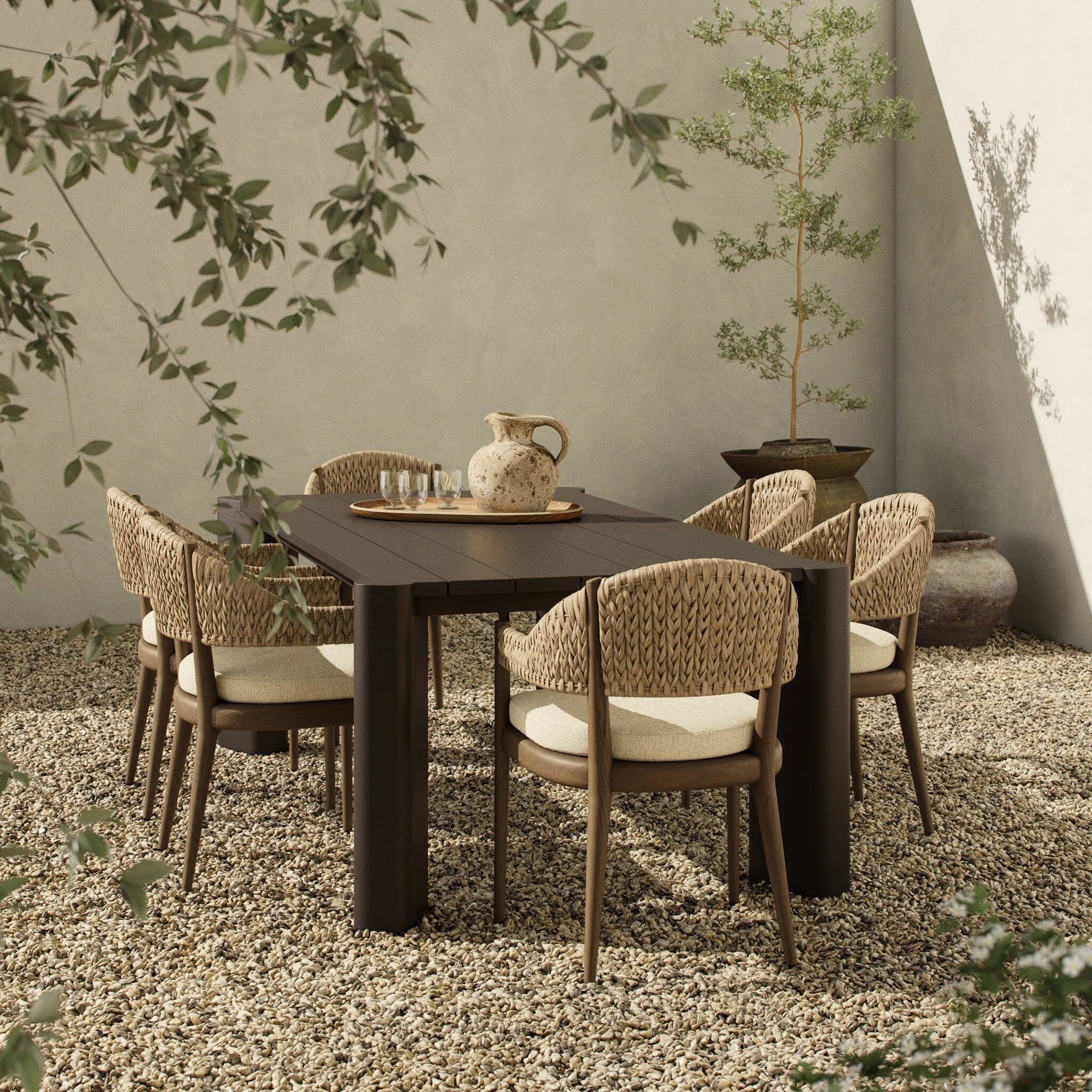 A Parsons-style outdoor dining table is defined by heavy proportions and angled, over-scaled legs. Crafted from bronze finished metal for a material statement. Cover or store indoors during inclement weather and when not in use.As lovers of wabi sabi materials at Amethyst, we love the nature inspired Soho Outdoor Metal Dining Table 86". Amethyst Home provides interior design, new home construction design consulting, vintage area rugs, and lighting in the Los Angeles metro area.