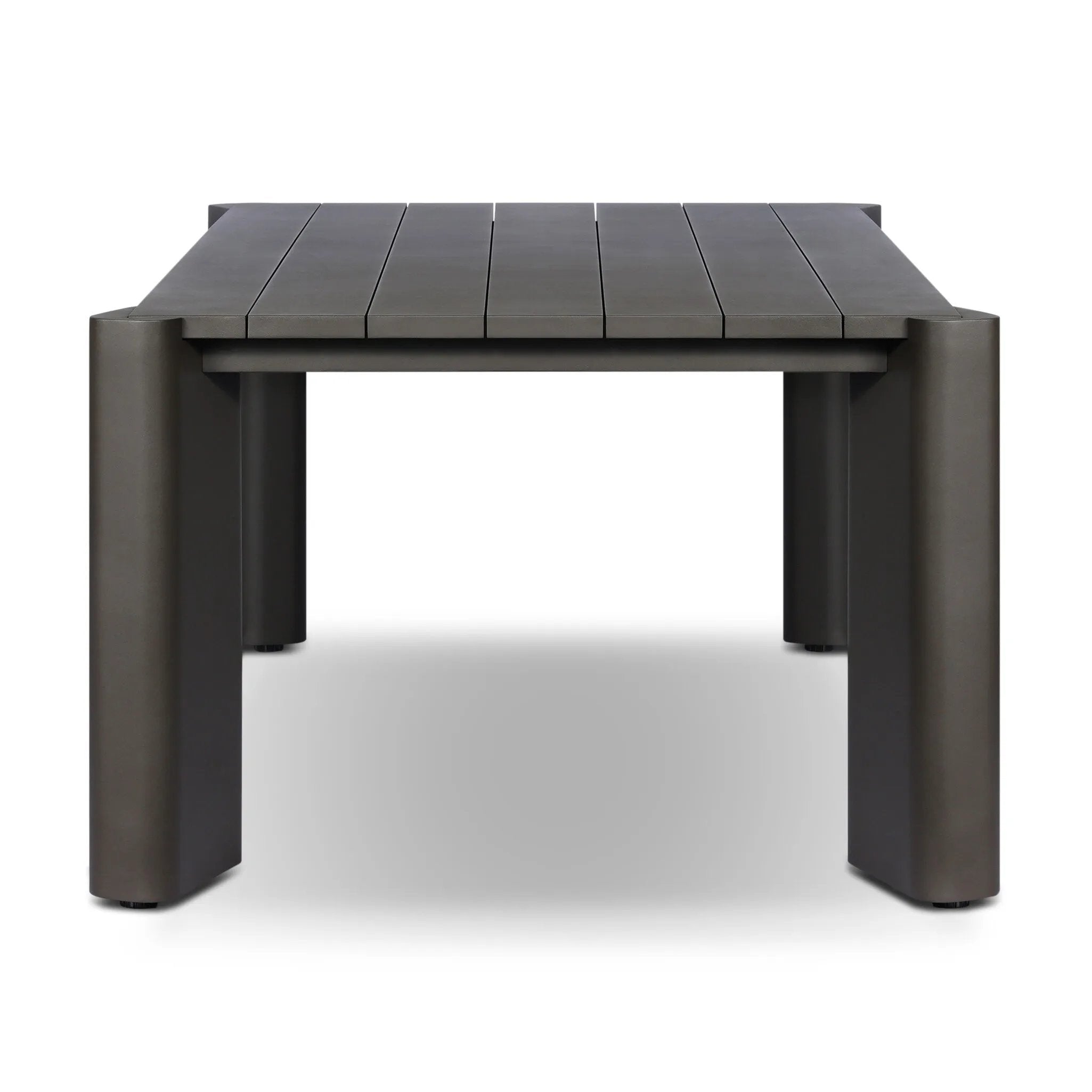 A Parsons-style outdoor dining table is defined by heavy proportions and angled, over-scaled legs. Crafted from bronze finished metal for a material statement. Cover or store indoors during inclement weather and when not in use.As lovers of wabi sabi materials at Amethyst, we love the nature inspired Soho Outdoor Metal Dining Table 86". Amethyst Home provides interior design, new home construction design consulting, vintage area rugs, and lighting in the Scottsdale metro area.
