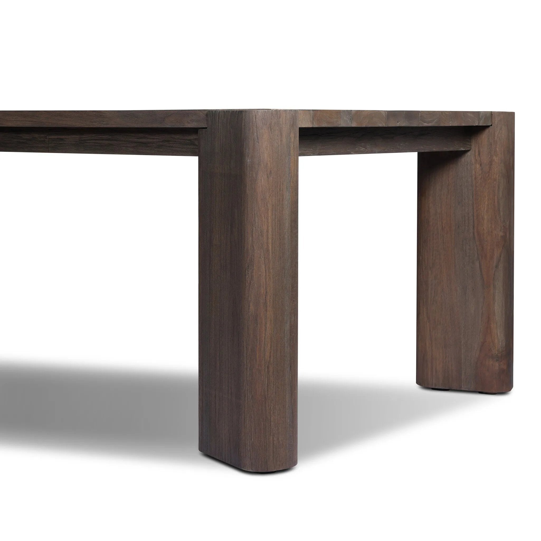 This Parsons-style outdoor dining table is defined by heavy proportions and over-scaled angled legs. Crafted from reclaimed wood and finished with a heritage brown stain to showcase natural cracks and patches for added character. Cover or store indoors during inclement weather and when not in use Amethyst Home provides interior design, new home construction design consulting, vintage area rugs, and lighting in the Portland metro area.