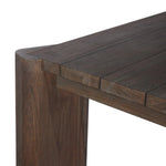 This Parsons-style outdoor dining table is defined by heavy proportions and over-scaled angled legs. Crafted from reclaimed wood and finished with a heritage brown stain to showcase natural cracks and patches for added character. Cover or store indoors during inclement weather and when not in use Amethyst Home provides interior design, new home construction design consulting, vintage area rugs, and lighting in the Scottsdale metro area.