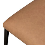Bring a slim, light look to the dining room. This dining chair pairs camel top-grain leather and bronzed iron to craft a simple, airy look. A tapered leg and decorative handle on the back elevate the look.As enthusiasts of natural materials at Amethyst, we love the warm modern inspired Somerson Dining Chair - Maestro Camel. Amethyst Home provides interior design, new home construction design consulting, vintage area rugs, and lighting in the Los Angeles metro area.