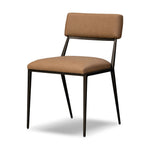 Bring a slim, light look to the dining room. This dining chair pairs camel top-grain leather and bronzed iron to craft a simple, airy look. A tapered leg and decorative handle on the back elevate the look.As enthusiasts of natural materials at Amethyst, we love the warm modern inspired Somerson Dining Chair - Maestro Camel. Amethyst Home provides interior design, new home construction design consulting, vintage area rugs, and lighting in the San Diego metro area.