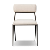 Bring a slim, light look to the dining room. This dining chair pairs cream performance fabric exclusive to Four Hands and bronzed iron to craft a simple, airy look. A tapered leg and decorative handle on the back elevate the look. Amethyst Home provides interior design, new home construction design consulting, vintage area rugs, and lighting in the Houston metro area.