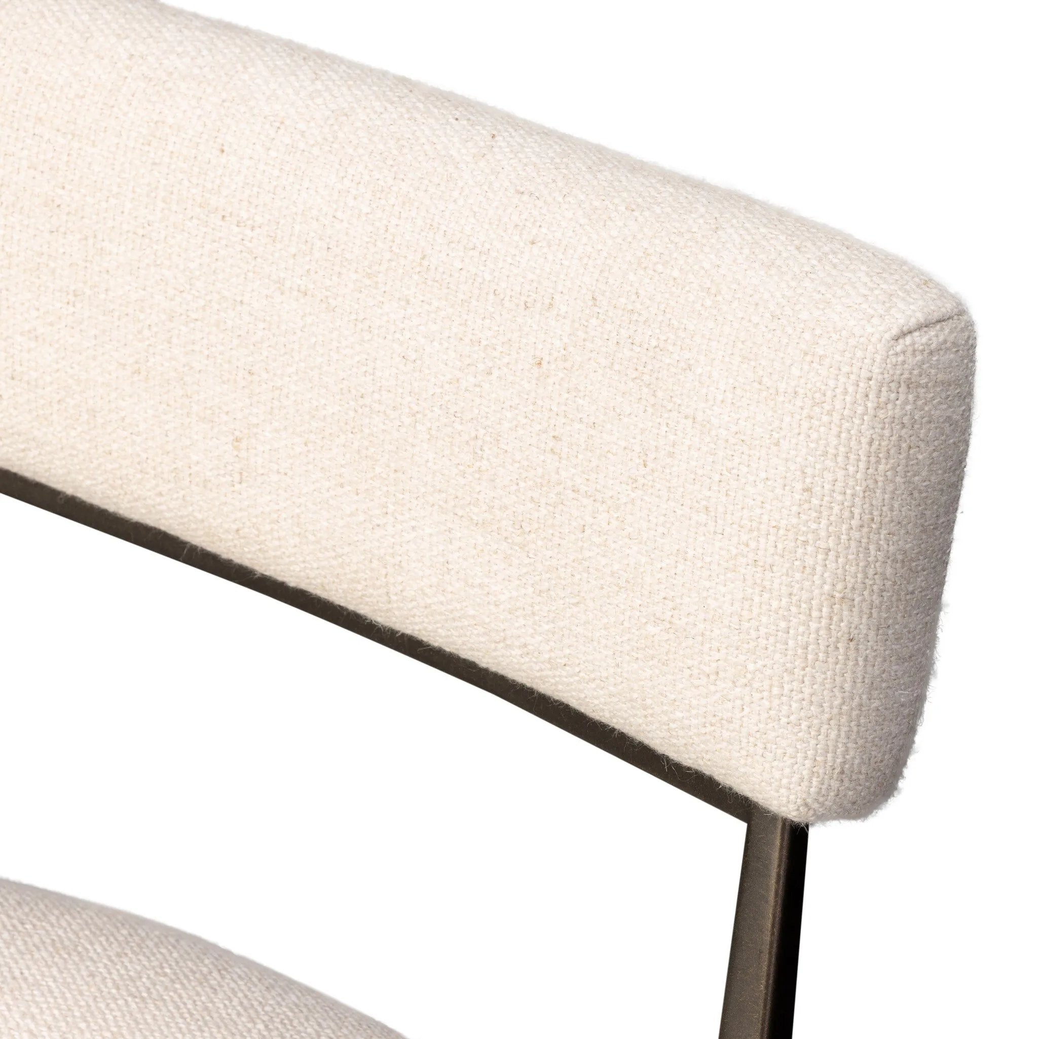 Bring a slim, light look to the dining room. This dining chair pairs cream performance fabric exclusive to Four Hands and bronzed iron to craft a simple, airy look. A tapered leg and decorative handle on the back elevate the look. Amethyst Home provides interior design, new home construction design consulting, vintage area rugs, and lighting in the Kansas City metro area.