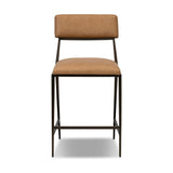 Bring a slim, light look to the dining room. This counter stool pairs camel top-grain leather and bronzed iron to craft a simple, airy look. A tapered leg and decorative handle on the back elevate the look.As fans of organic modern materials at Amethyst, we love the optimistic inspired Somerson Stool - Counter. Amethyst Home provides interior design, new home construction design consulting, vintage area rugs, and lighting in the Houston metro area.