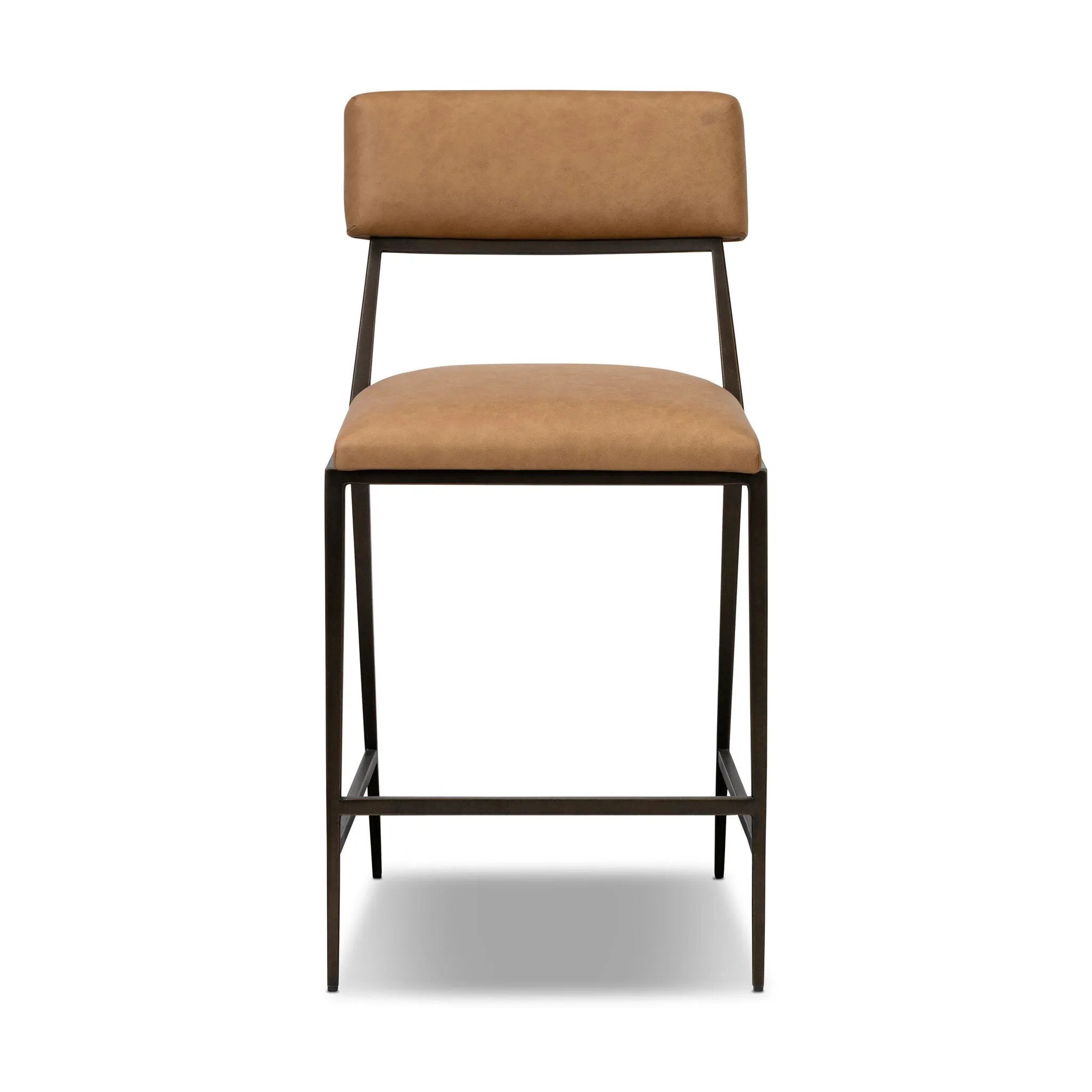 Bring a slim, light look to the dining room. This counter stool pairs camel top-grain leather and bronzed iron to craft a simple, airy look. A tapered leg and decorative handle on the back elevate the look.As fans of organic modern materials at Amethyst, we love the optimistic inspired Somerson Stool - Counter. Amethyst Home provides interior design, new home construction design consulting, vintage area rugs, and lighting in the Houston metro area.