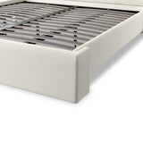 A shorter wingspan and geometric cutouts define this modern-day shelter wingback bed, designed for comfort from every angle. Upholstered in a cream fabric with subtle texture and a soft hand Amethyst Home provides interior design, new home construction design consulting, vintage area rugs, and lighting in the Dallas metro area.