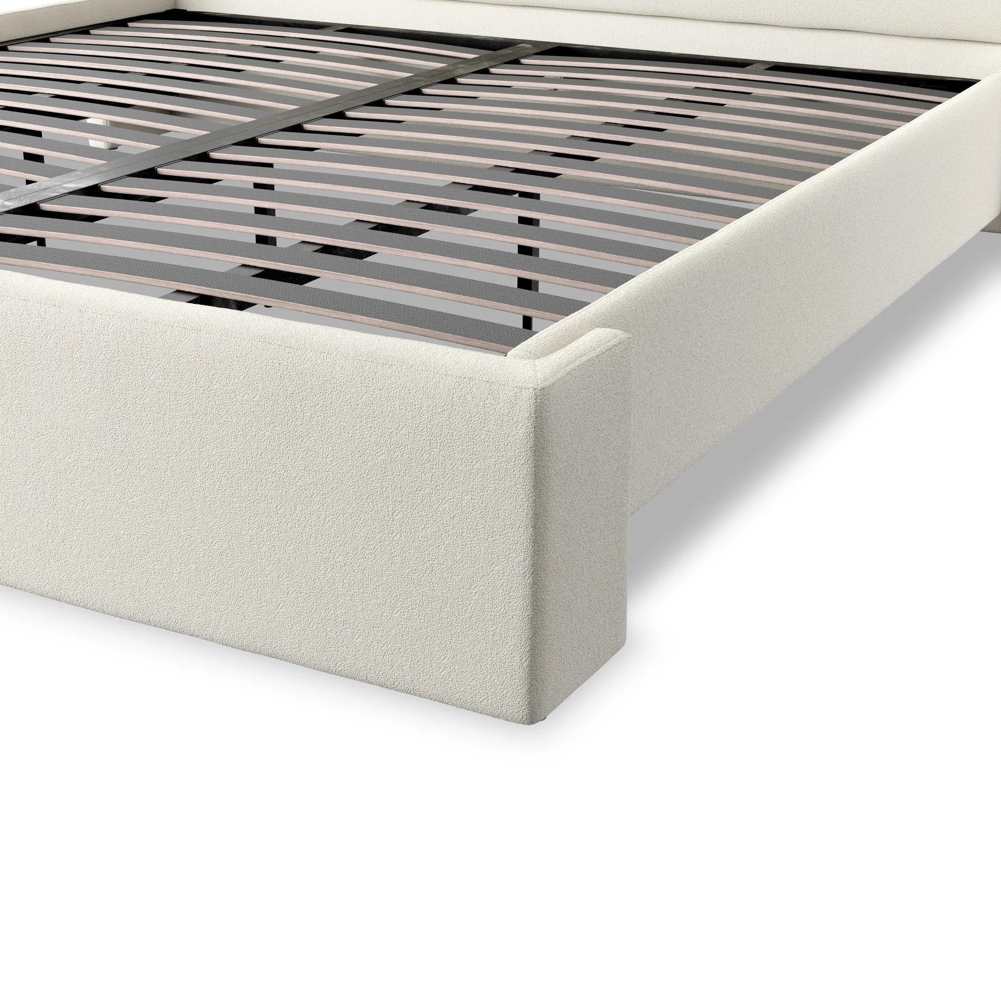 A shorter wingspan and geometric cutouts define this modern-day shelter wingback bed, designed for comfort from every angle. Upholstered in a cream fabric with subtle texture and a soft hand Amethyst Home provides interior design, new home construction design consulting, vintage area rugs, and lighting in the Dallas metro area.