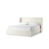 A shorter wingspan and geometric cutouts define this modern-day shelter wingback bed, designed for comfort from every angle. Upholstered in a cream fabric with subtle texture and a soft hand Amethyst Home provides interior design, new home construction design consulting, vintage area rugs, and lighting in the Kansas City metro area.