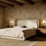 A shorter wingspan and geometric cutouts define this modern-day shelter wingback bed, designed for comfort from every angle. Upholstered in a cream fabric with subtle texture and a soft hand Amethyst Home provides interior design, new home construction design consulting, vintage area rugs, and lighting in the Laguna Beach metro area.