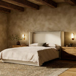 A shorter wingspan and geometric cutouts define this modern-day shelter wingback bed, designed for comfort from every angle. Upholstered in a cream fabric with subtle texture and a soft hand Amethyst Home provides interior design, new home construction design consulting, vintage area rugs, and lighting in the Miami metro area.