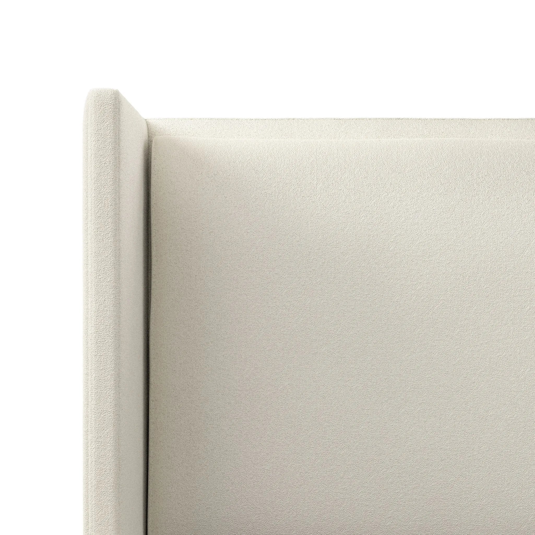 A shorter wingspan and geometric cutouts define this modern-day shelter wingback bed, designed for comfort from every angle. Upholstered in a cream fabric with subtle texture and a soft hand Amethyst Home provides interior design, new home construction design consulting, vintage area rugs, and lighting in the San Diego metro area.