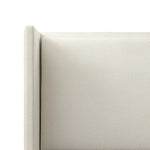 A shorter wingspan and geometric cutouts define this modern-day shelter wingback bed, designed for comfort from every angle. Upholstered in a cream fabric with subtle texture and a soft hand Amethyst Home provides interior design, new home construction design consulting, vintage area rugs, and lighting in the Seattle metro area.