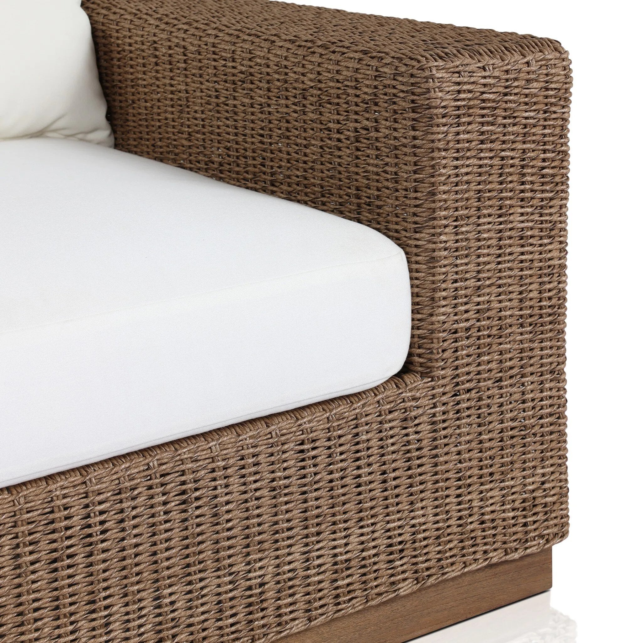 Featuring Suri Arashi Salt Outdoor Chair by Four Hands at Amethyst Home. Elevate your outdoors. A wide-format outdoor chair features a faux hyacinth frame and plinth base. Linear details and a boxy silhouette make this piece truly timeless, while a knife-edge back  cushion softens the whole look. Upholstered in 100% olefin, known for its UV-resistant, wat. Amethyst Home provides interior design, new home construction design consulting, vintage area rugs, and lighting in the Kansas City metro area.