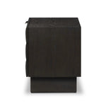 A softened Brutalist take on the traditional nightstand. The monolithic piece’s black oak veneer case sits atop a matching pedestal for an element of exaggeration. A grid pattern with inflated volume adds drama.As enthusiasts of luxe materials at Amethyst, we love the warm modern inspired Swell Nightstand - Dry Black Oak Veneer. Amethyst Home provides interior design, new home construction design consulting, vintage area rugs, and lighting in the Newport Beach metro area.