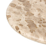 Hammered aged brass forms a tulip-shaped base with ball details for a design-forward touch. Bullnose edges on a rounded fossil marble tabletop soften the whole look Amethyst Home provides interior design, new home construction design consulting, vintage area rugs, and lighting in the Seattle metro area.