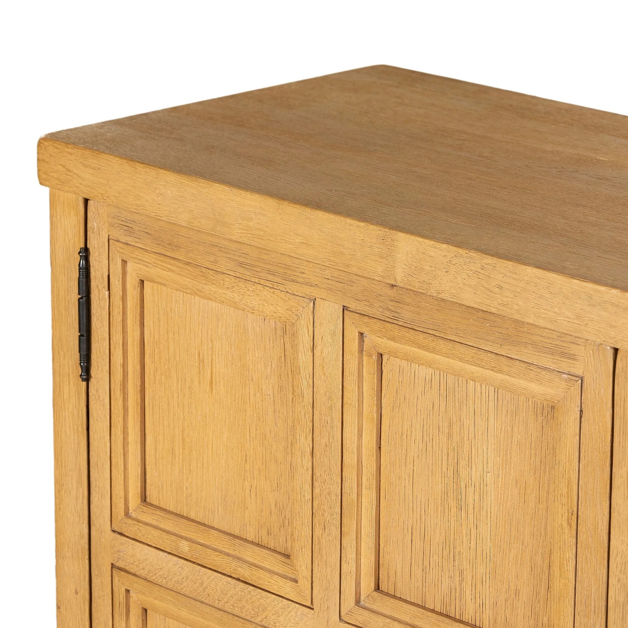 Worn oak sideboard with paneled doors, all atop an elevated stand. With natural cracks for character, this piece brings bonus storage and vintage charm to dining spaces Amethyst Home provides interior design, new home construction design consulting, vintage area rugs, and lighting in the Laguna Beach metro area.