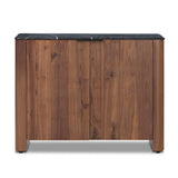 Design your space with hallmark features inspired by soft Brutalism. Made from solid walnut and poplar woods with a natural finish, the cabinet is topped with a black marble top with half bullnose edging for smooth contours. Double doors open to two shelves for ample storage. High-quality hardware is crafted from black iron. Amethyst Home provides interior design, new home construction design consulting, vintage area rugs, and lighting in the Kansas City metro area.