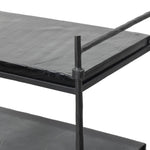 Elevate cocktail hour with an always-in-style rolling bar cart. Crafted from black hammered metal with three tiers of smoked cast glass, offering smooth surface space for storage and display Amethyst Home provides interior design, new home construction design consulting, vintage area rugs, and lighting in the Houston metro area.